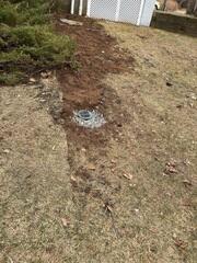 LawnScape was installed at the discharge point to direct water safely away from the home without disrupting the yard.