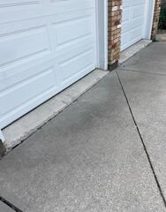 See that ledge? A sunken garage floor like this Dundas home is a prime tripping hazard for kids. We fix these by lifting the concrete back to a flush, safe finish.