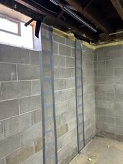 During: Our Foreman, Kevin, and his crew attached the CarbonArmor strips to the wall.