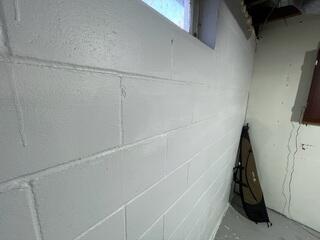Before: Our Design Specialist, Ryan, recommended securing GeoLock Wall Anchors on the damaged walls.