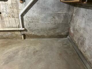 Before: Eric, one of our Design Specialists, recommended securing WaterGuard around the basement perimeter.