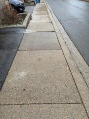 This shot shows the path after our polyurethane injection process. By filling the voids caused by erosion, we stabilized the ground and brought the sunken slabs back into alignment with the rest of the walkway. While addressing years of ground movement, we successfully eliminated the dangerous trip hazards, making the route to the playground safe and accessible for the community once again.