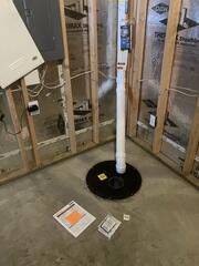 During: Our Foreman, Gustavo, secured a Radon Mitigation System inside and outside the home.