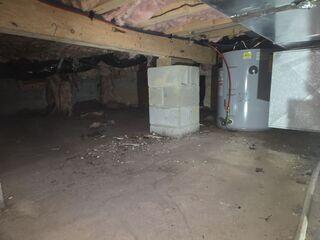 Before encapsulation: Visible moisture along foundation walls.