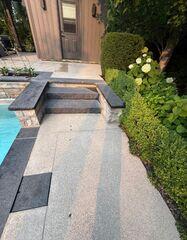 A close-up of the transition zone. You can see where the slabs started to pull away, creating gaps and trip hazards. Our polymer injection targets these exact spots to fill the voids underneath.