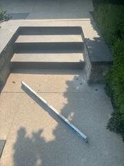 The level doesn't lie. We use precision tools to monitor the lift in real-time, bringing the sunken stairs back toward their original height and restoring a smooth, safe surface.