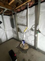 During: Our Foreman, Aaron, and his crew secured all the waterproofing products in the basement.