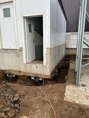 During: Our foundation Foreman, Matt, and his crew secured the Helical Piers below the sinking foundation.
