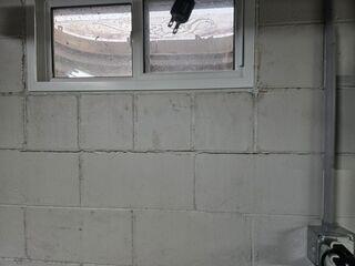 Before: The homeowner was concerned about the large crack growing in the foundation wall.