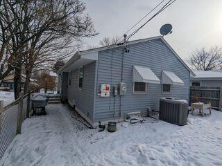Before: Our Design Specialist, Kyle, recommened securing the Radon Mitigation System outside the home.