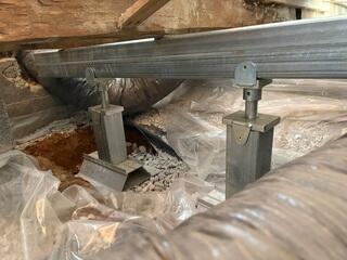 Here are two of the posts we installed in the crawl space. They help lift and support the steel beam running across the top, which is running perpendicular to the floor joists above.