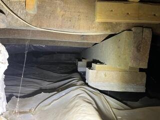 This photo shows what our Inspector saw upon the initial inspection in the crawl space. Two of the rooms in the house were supported by wood that had been shimmed together.