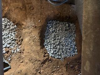 We then backfilled the holes with limestone to make for a sturdy base. Unlike wet soil, limestone won't settle over time.