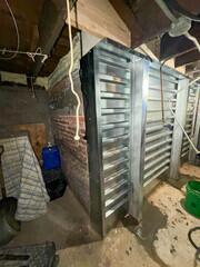 This image showcases the completed EverBrace Wall Restoration System, a premier structural solution for severely compromised foundations. By integrating heavy-duty steel I-beams with reinforced corrugated panels and high-density foam injection, we have effectively transferred the structural load away from the original deteriorating masonry and onto this high-capacity support system.