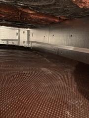 Silver Glo is installed around the crawl space and drainage matting is installed on the ground level.