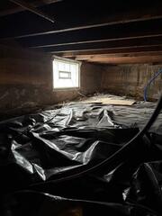 Before: Our Design Specialist, Tony, recommended encapsulating the water-damaged crawl space.