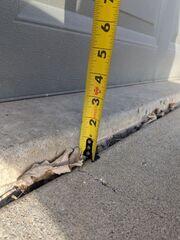 Before: Our Design Specialist, Kyle, suggested installing PolyLevel below the sinking slabs and repairing the cracks with NexusPro.