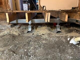 During: Our Foreman, Jose, and his crew secured seven Helical Piers below the sinking foundation.