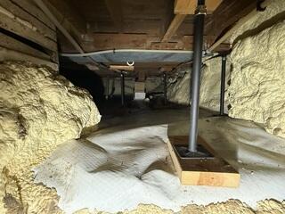 Before: Our Design Specialist, Dustin, recommended securing SmartJacks to properly support the uneven, damaged foundation.