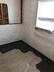 Interior basement waterproofing system installed along the perimeter of this Clearfield, Utah home to manage water intrusion and protect the foundation from moisture damage.