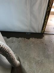 Close-up view of basement drain installation in Clearfield, UT showing perimeter waterproofing system designed to redirect water and relieve hydrostatic pressure.