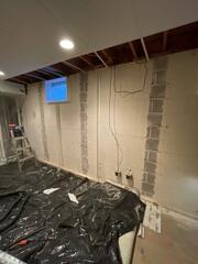 During: Our Foreman, Victor, and his crew worked hard to secure the PowerBraces on the damaged foundation walls.