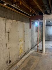 Before: Our Design Specialist, Ian, suggested waterproofing the entire basement.