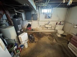 Before: Brady, our Design Specialist, recommended securing waterproofing products throughout the basement.