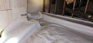 Vapor barrier not properly sealed, allowing moisture and water to fill the crawl space.