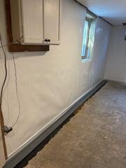 During: Our Foreman, Diego, and his crew secured several waterproofing products along the water-damaged wall.