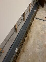During: Jose, our Foreman, and his crew secured WaterGuard around the basement perimeter.
