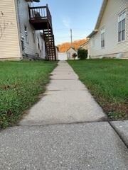 Before: Our Design Specialist, Ryan, recommended lifting and leveling the walkway back to its original level.