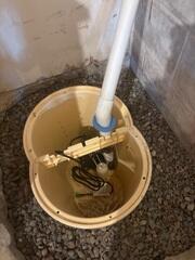 During: Our Foreman, Jeus, and his crew worked hard to secure the TripleSafe sump pump.