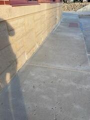 During: Our Foreman, Charlie, and his crew succesfully secured all the products below the damaged sidewalk.