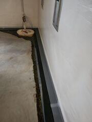 During: Our Foreman, Arturo, and his crew worked hard to secure all the products in the basement.