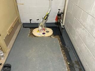 During: Our Foreman, Kiko, and his crew secured the WaterGuard and TripleSafe sump pump.