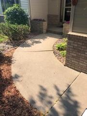 Before: Our Design Specialist recommended lifting and leveling the walkway back to its original position.