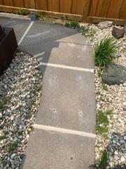 During: Our Foreman, Patrick, and his crew succesfully lifted and leveled the sidewalk back into place.