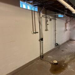 Before: Our Design Specialist, Ryan, recommended securing several waterproofing products throughout the basement.