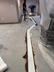 During: Our Foreman, Raul, and his crew started by securing WaterGuard around the basement perimeter.