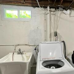 Visible cracks under the window and above the sink in the laundry