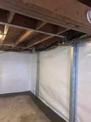 For the structural repair, we installed the PowerBrace wall support system along the affected wall. The system was secured to stabilize the wall immediately and prevent any further inward movement, with the option for future adjustment if needed. Following installation, the basement is now dry, stable, and significantly more functional. Water intrusion has been effectively controlled, even during wet conditions, and the stabilized wall no longer shows signs of ongoing movement.