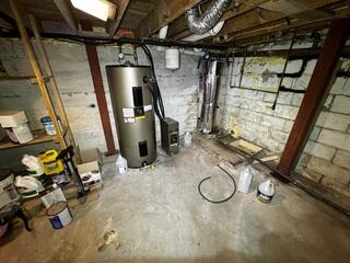 Water was entering at the floor-to-wall joint, leaving sections of the basement damp and unreliable for storage.