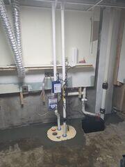 Water from the waterguard and trench drain flows efficiently to a TripleSafe sump pump system.