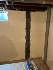 During: Our Foreman and his crew worked hard to secure all the foundation repair products in the basement.