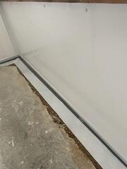 During: Our Foreman, Gabriel, and his crew worked hard to secure all the waterproofing products in the basement.