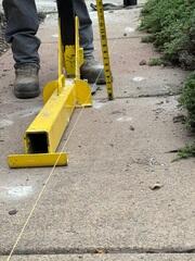 Beginning steps of repairing the sinking sidewalk