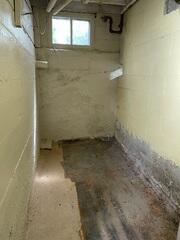 Before: Our Design Specialist, Eric, recommended securing several waterproofing products throughout the basement.