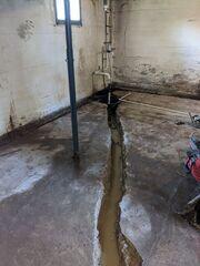 During: Our Foreman, Lane, and his crew secured all the waterproofing products in the basement.