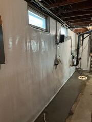 The CleanSpace makes the wall look so much brighter and cleaner, as well as drains that moisture down to the WaterGuard System. You can also see the new sump pump in the corner.